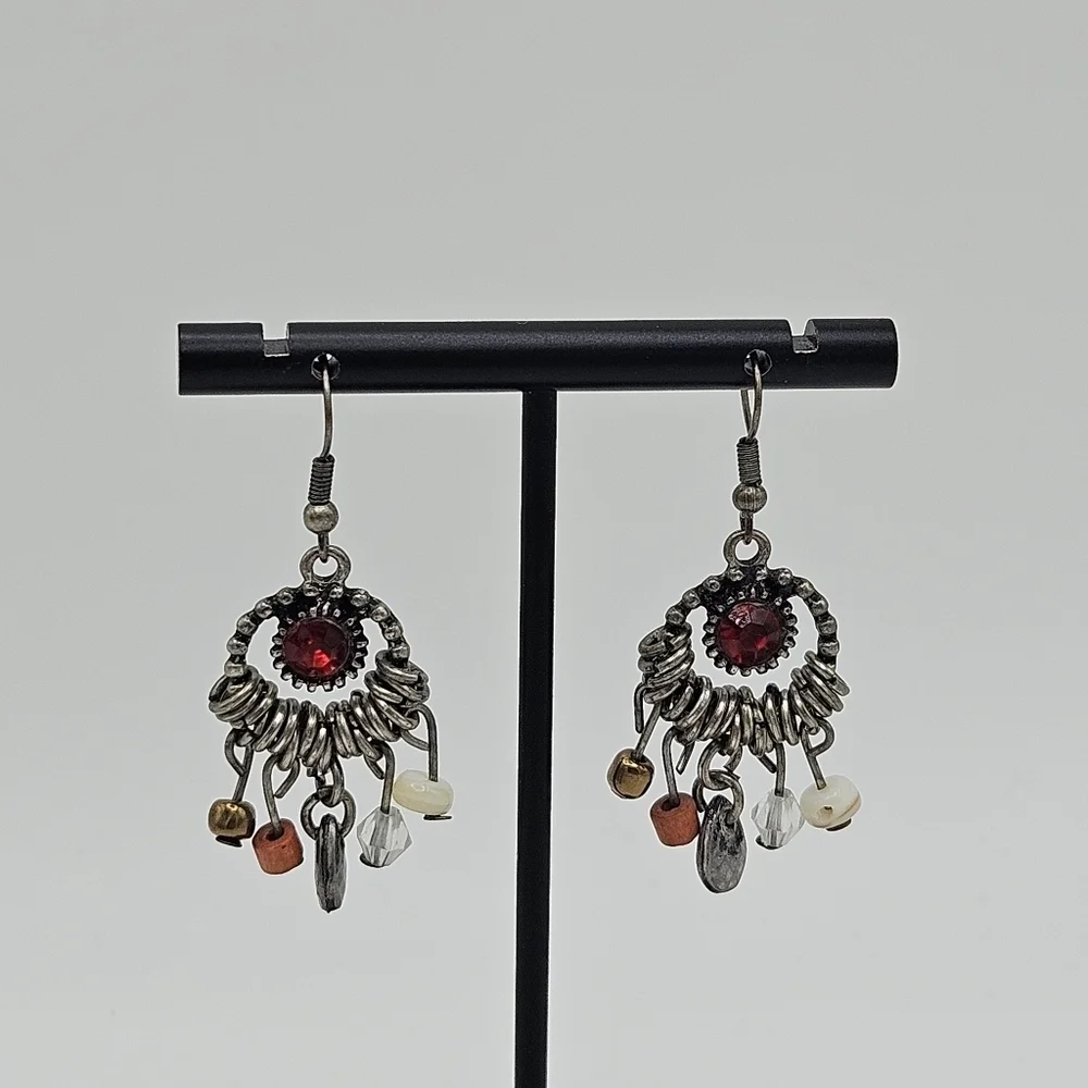 silver tone chandelier earrings with red center and beaded dangles